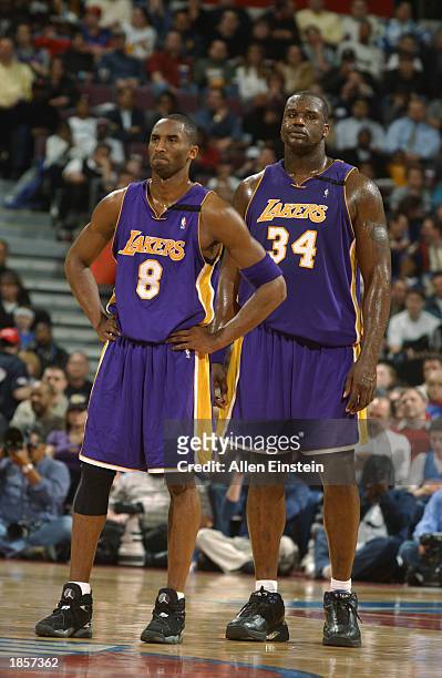Shaquille O'Neal and Kobe Bryant of the Los Angeles Lakers look on dejected during the NBA game against the Detroit Pistons at The Palace of Auburn...