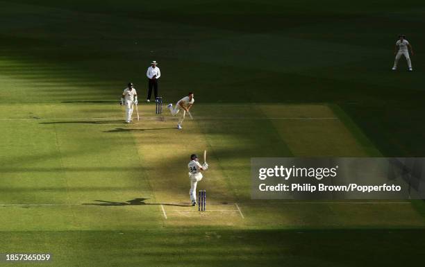 Shan Masood of Pakistan hits a ball bowled by Mitch Marsh during day two of the Men's First Test match between Australia and Pakistan at Optus...