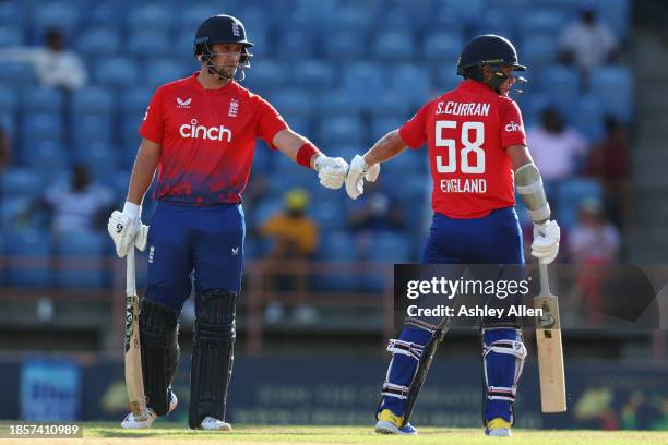 Sam Curran and Liam Livingstone of England during the 2nd T20 International match between West Indies and England at the National Cricket Stadium on...