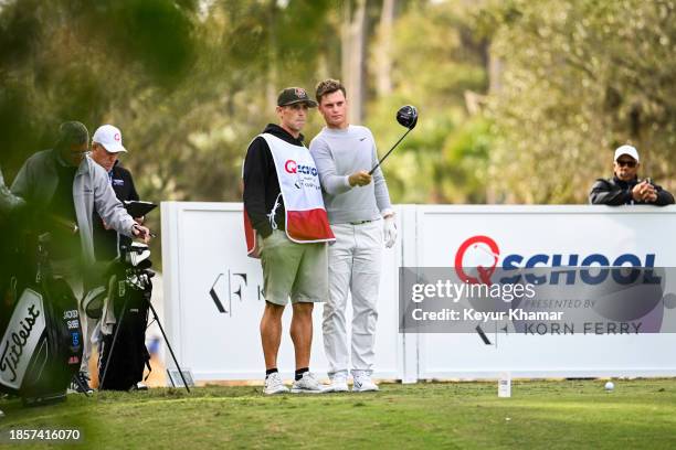 William Mouw talks to his caddie before playing his shot from the 10th tee during the first round of the PGA TOUR Q-School presented by Korn Ferry...
