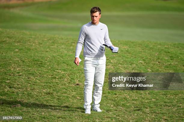 William Mouw checks his yardage book from the 10th hole rough during the first round of the PGA TOUR Q-School presented by Korn Ferry tournament on...