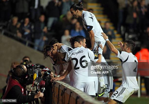 Swansea players celebrate Michu's opening goal during the UEFA Europa League, Group A football match between Swansea City and Kuban Krasnodar at the...