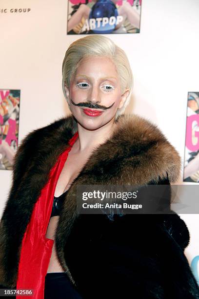 Lady Gaga poses for the press prior to the prelistening fan event of her new CD 'Artpop' at Halle Berghain on October 24, 2013 in Berlin, Germany.