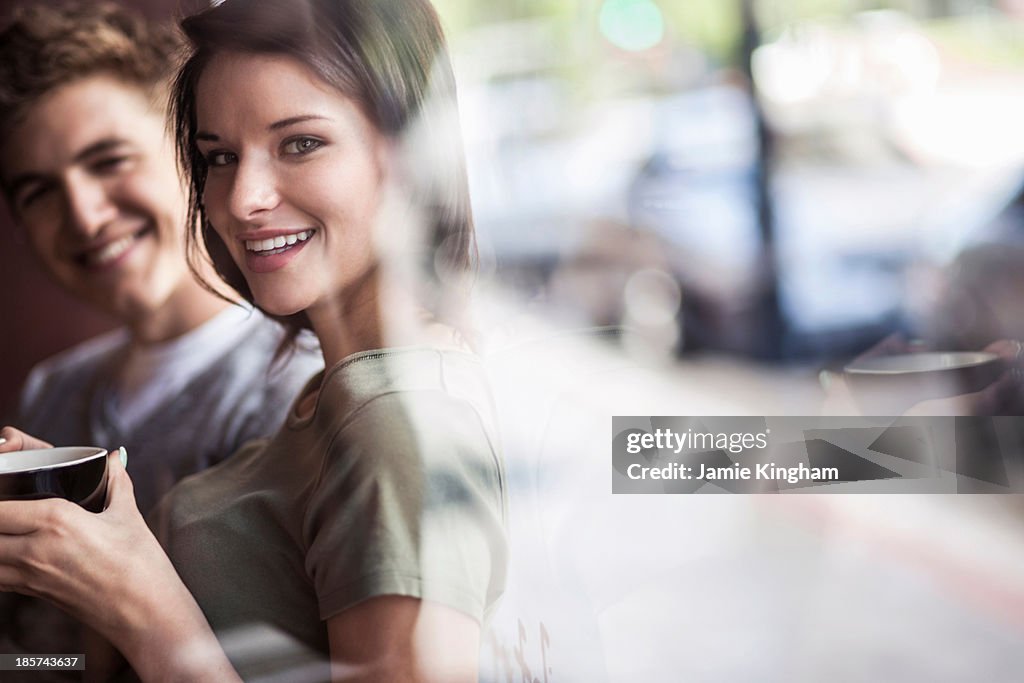 Young couple inside cafe
