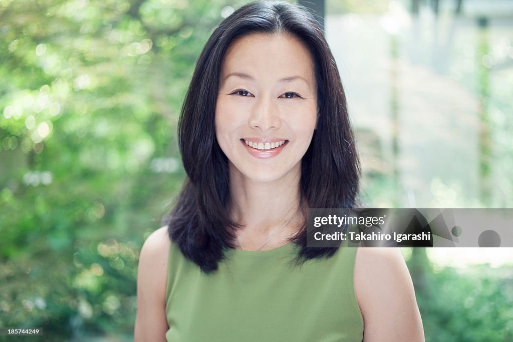 Mature woman smiling,  portrait