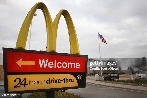 Sign directs customers to the drive-thru at a McDonald's restaurant on October 24, 2013 in Des Plaines, Illinois. McDonald's has announced it will...