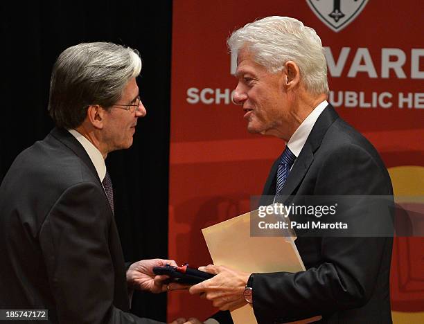 Bill Clinton, 42nd President of the United States and Founder of the Clinton Foundation receives the Centennial Medal from Julio Frenk, dean of the...