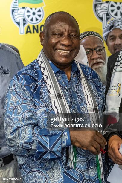 South African President and president of the African National Congress Cyril Ramaphosa, wearing a keffiyeh, poses for a photo at the joint press...