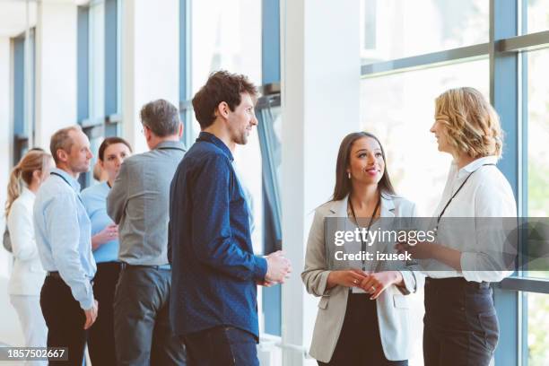 business people in convention center during coffee break - business casual bildbanksfoton och bilder