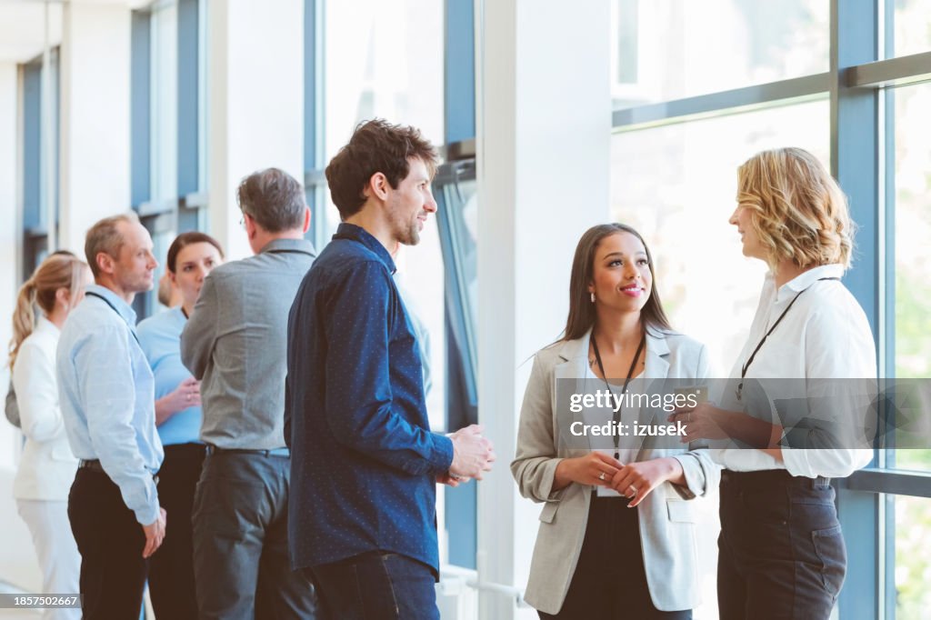 Business people in convention center during coffee break