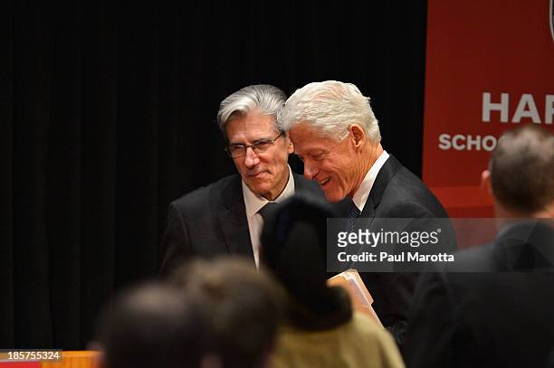 Bill Clinton, 42nd President of the United States and Founder of the Clinton Foundation receives the Centennial Medal from Julio Frenk, dean of the...