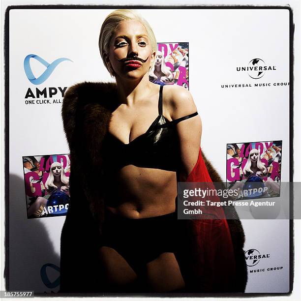 Lady Gaga poses for the press prior to the prelistening fan event of her new Album 'Artpop' at Halle Berghain on October 24, 2013 in Berlin, Germany.