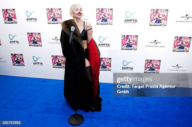 Lady Gaga poses for the press prior to the prelistening fan event of her new Album 'Artpop' at Halle Berghain on October 24, 2013 in Berlin, Germany.