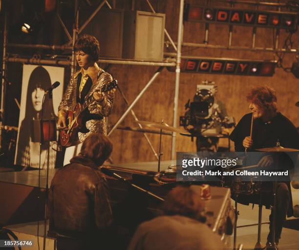 British rock group Cream perform on the TV show 'Ready Steady Go!' in London in 1966. Left to right: Guitarist Eric Clapton, bass player Jack Bruce...