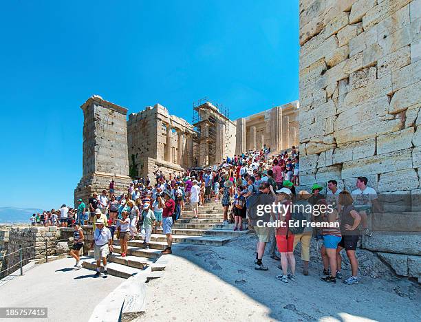 crowds at the entrance to the acropolis - acropolis athens stock pictures, royalty-free photos & images