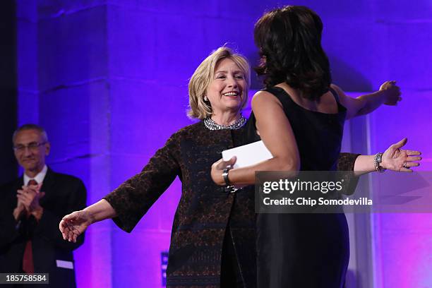 Former Secretary of State Hillary Clinton embraces Center for American Progress President Neera Tanden before adressing a gala celebrating the 10th...