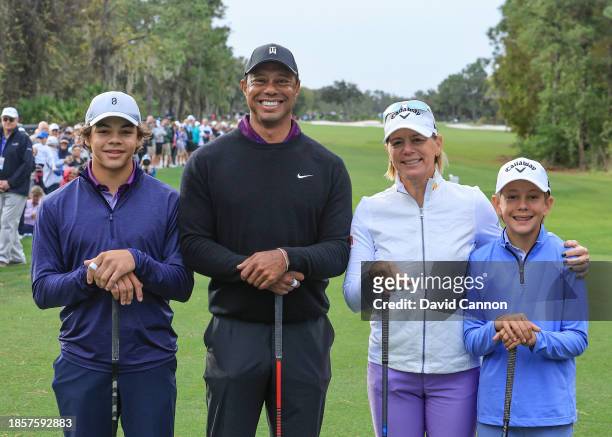 Tiger Woods of the United States poses with his son Charlie Woods, Annika Sorenstam of Sweden and her son Will McGee on the first tee during the...