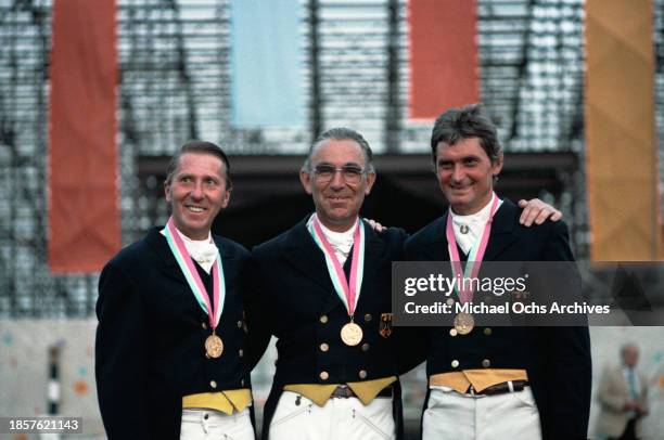 German equestrian Herbert Krug, German equestrian Reiner Klimke, and German equestrian Uwe Sauer, gold medal winners in the team dressage event of...