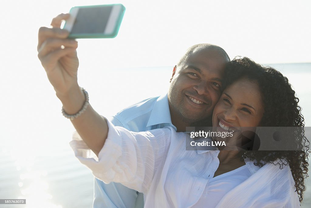 Black couple taking self portrait