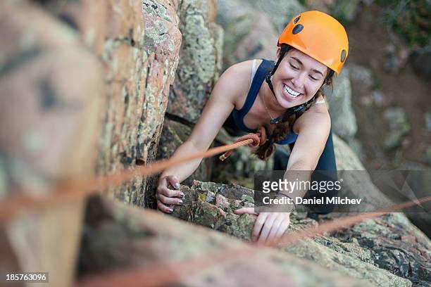 girl rock having fun while rock climbing. - rocky mountaineer stock pictures, royalty-free photos & images