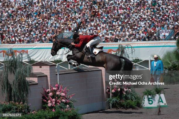 German equestrian Paul Schockemohle, riding Deister, clears a fence in the individual jumping event of the equestrian competition at the 1984 Summer...