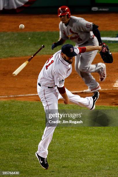 John Lackey of the Boston Red Sox tries to field a ball hit by Yadier Molina of the St. Louis Cardinals during Game Two of the 2013 World Series at...