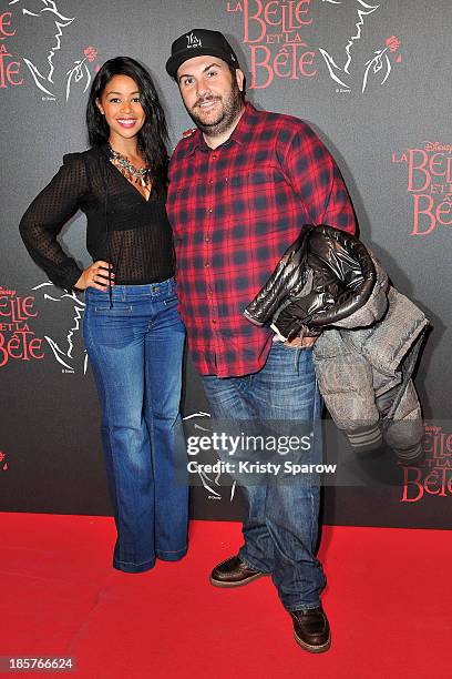 Aurelie Konate and Laurent Ournac attend the 'Beauty and the Beast' Paris Premiere at Theatre Mogador on October 24, 2013 in Paris, France.