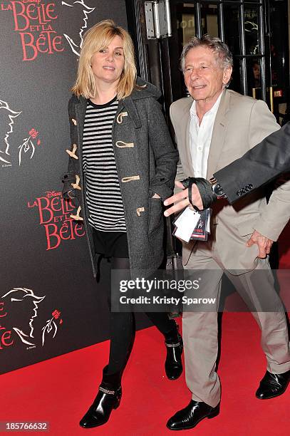 Emmanuelle Seigner and Roman Polanski arrive to the 'Beauty and the Beast' Paris Premiere at Theatre Mogador on October 24, 2013 in Paris, France.