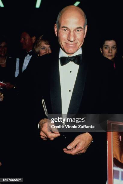 British actor Patrick Stewart, wearing a tuxedo, a white shirt with square buttons and bow tie, attends the 42nd Primetime Emmy Awards, held at the...