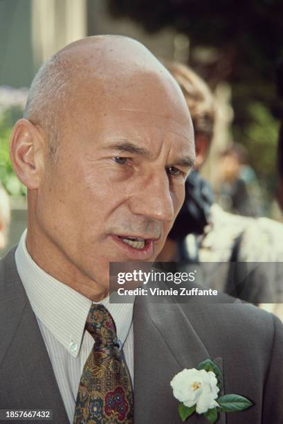 British actor Patrick Stewart, wearing a grey jacket with a white buttonhole, attends a wedding ceremony held at Saint Sophia Greek Orthodox...