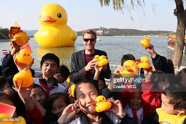 Dutch artist Florentijn Hofman attends a farewell party for the Rubber Duck at the Summer Palace on October 24, 2013 in Beijing, China. The 18-meter...