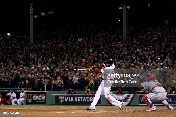 David Ortiz of the Boston Red Sox hits a two run home run in the sixth inning against the St. Louis Cardinals during Game Two of the 2013 World...