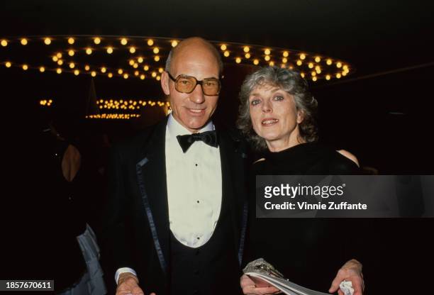 British actor Patrick Stewart, wearing a tuxedo and bow tie, and his wife, Sheila Falconer, who wears a black outfit, attend the 45th Golden Globe...