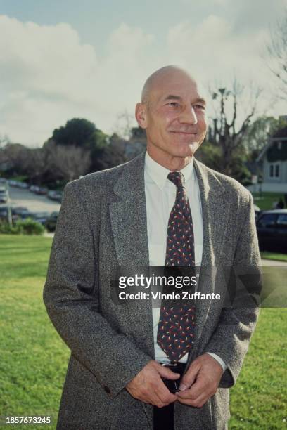 British actor Patrick Stewart, wearing a grey tweed blazer over a white shirt with a patterned tie, attends the inaugural BAFTA Los Angeles Tea...