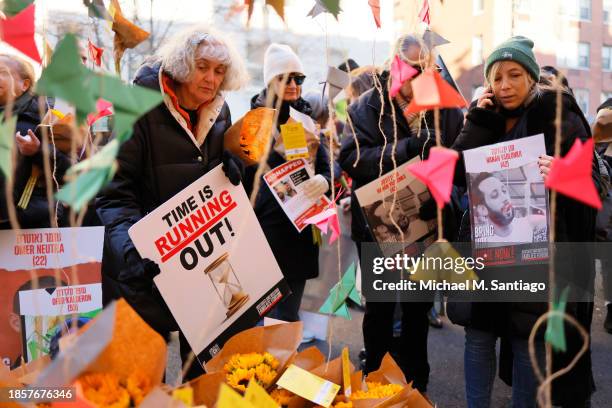 People join family members of hostages held by Hamas as they gather to protest outside the home of U.N. Secretary General António Guterres on...