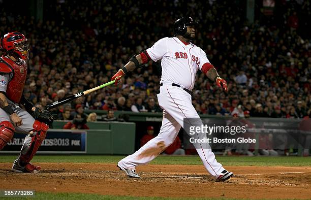 Red Sox designated hitter David Ortiz hits a two run home run in the sixth inning during Game Two of the 2013 Major League Baseball World Series...