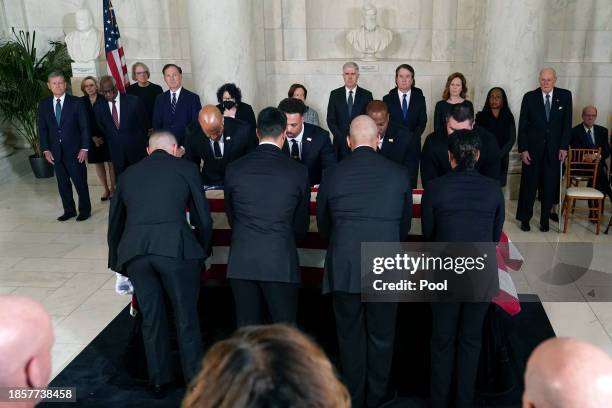 Supreme Court Police officers place the flag-draped casket of retired Supreme Court Justice Sandra Day O'Connor onto the Lincoln Catafalque before a...