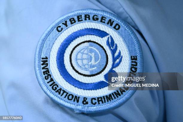 This photograph taken on December 18, 2023 at the Gendarmerie Nationale headquarters in Issy-les-Molineaux, south of Paris, shows the logo of the...