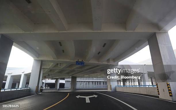 Street to a logistics center sits empty at China Pilot Free Trade Zone's Pudong free trade zone in Shanghai, China, on Thursday, Oct. 24, 2013. The...