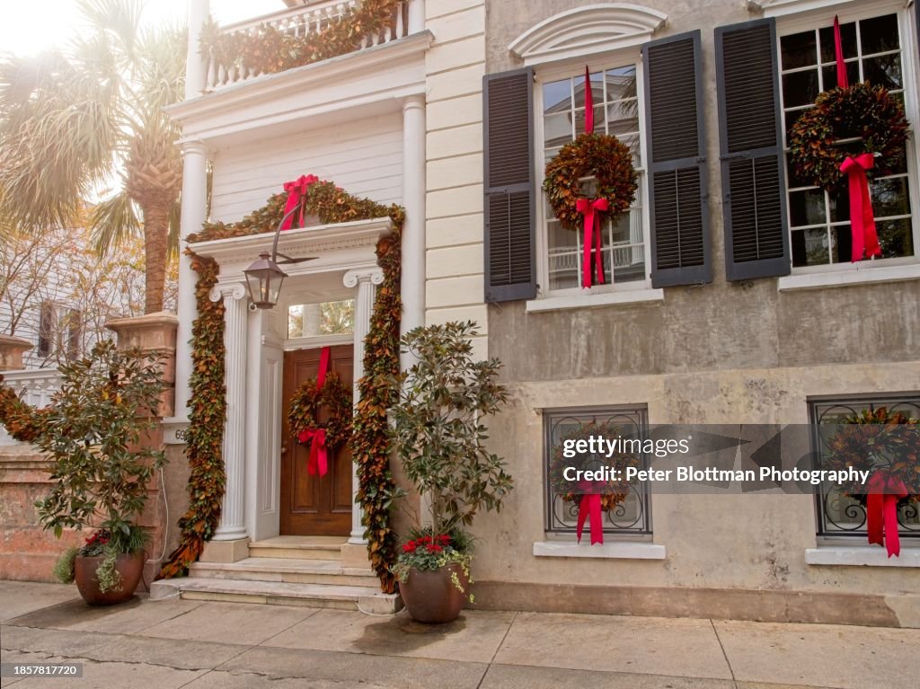 Poyas-Mordecai House decorated for Christmas with wreaths and red bows in each window