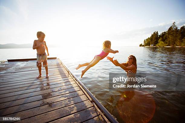 swimming in a lake. - children swimming photos et images de collection