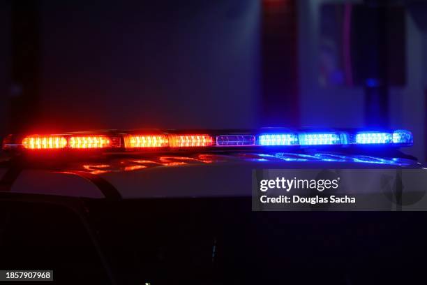 police - flashing lights during a nighttime crime scene - police lights stock pictures, royalty-free photos & images