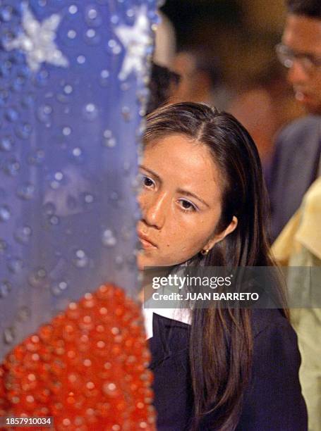 Several dresses desinged with the colors of the Venezuelan flag are exhibited in a hotel in Caracas, 13 March 2003. These dresses will be worn by the...