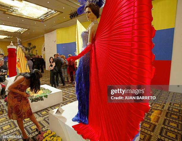Several dresses desinged with the colors of the Venezuelan flag are exhibited in a hotel in Caracas, 13 March 2003. These dresses will be worn by the...