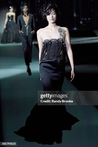 Model walks the runway during the Armani - One Night Only New York at SuperPier on October 24, 2013 in New York City.