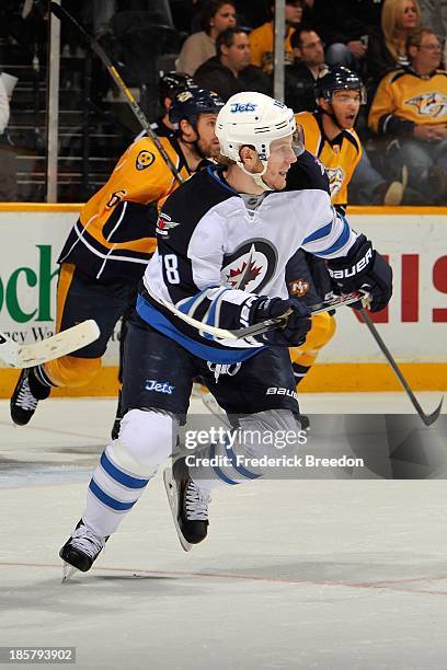 Bryan Little of the Winnipeg Jets skates against the Nashville Predators at Bridgestone Arena on October 24, 2013 in Nashville, Tennessee.