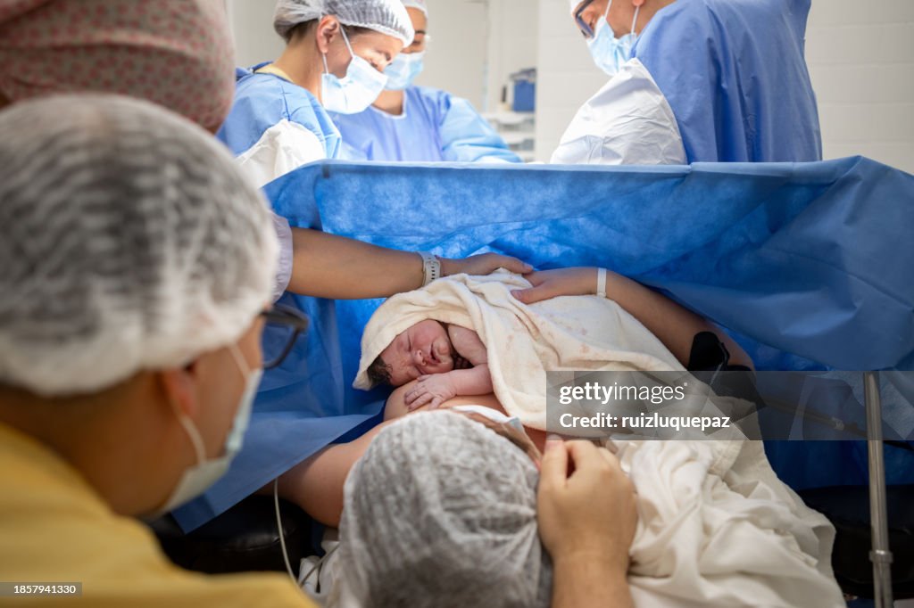 Mother and newborn daughter by cesarean section