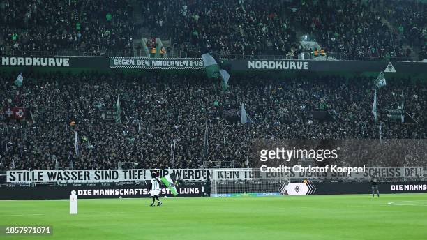 Fans show a banner in protest during the Bundesliga match between Borussia Mönchengladbach and SV Werder Bremen at Borussia Park Stadium on December...