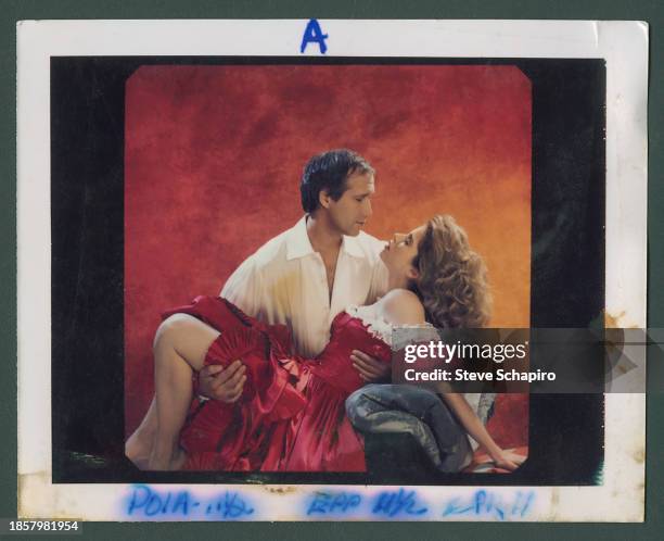 American actors Chevy Chase and Julianne Phillips pose, in a pardoy of 'Gone with the Wind,' for their own film 'Fletch Lives' , Los Angeles,...