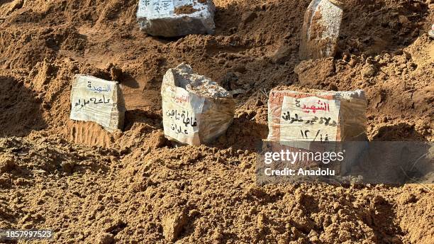 Bodies of Palestinians killed in Israeli attacks are buried in mass graves as more than 100 have been killed in the recent attacks on Jabalia refugee...